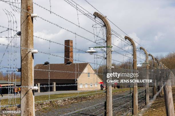 Barbed wire fence encloses the memorial site of the former Nazi concentration camp Buchenwald prior to the commemoration ceremony to mark the 77th...