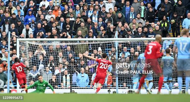 Liverpool's Senegalese striker Sadio Mane celebrates scoring the team's second goal during the English Premier League football match between...