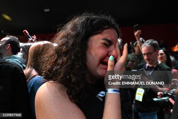 French leftist party La France Insoumise presidential candidate Jean-Luc Melenchon's supporter reacts at Cirque D'Hiver in Paris on April 10 as...
