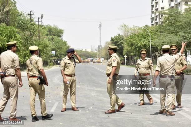 Police personnel deployed during the demolition test blast at Supertech Twin Towers in Sector 96A, on April 10, 2022 in Noida, India. The 32-storeyed...