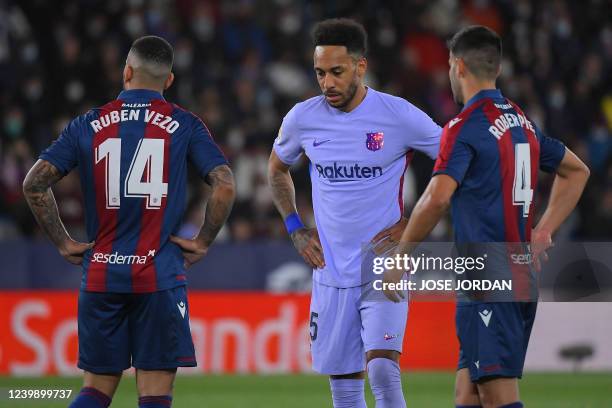 Barcelona's Gabonese midfielder Pierre-Emerick Aubameyang reacts during the Spanish league football match between Levante UD and FC Barcelona at the...