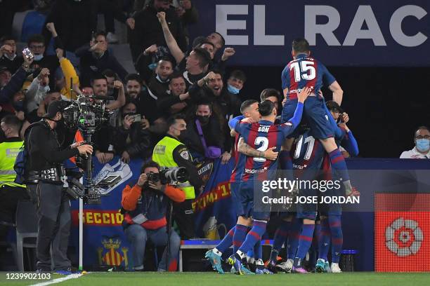 Levante's players celebrate their goal scored by Spanish midfielder Jose Luis Morales during the Spanish league football match between Levante UD and...