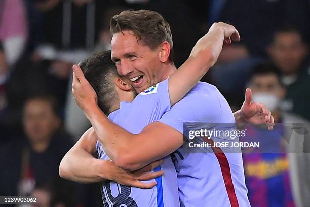 Barcelona's Dutch forward Luuk de Jong celebrates scoring his team's third goal during the Spanish league football match between Levante UD and FC...