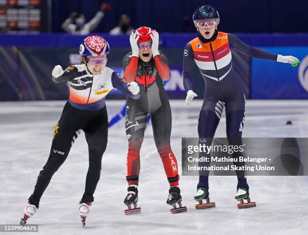 Team Canada, Team Netherlands and Team Korea cross the finish line during the 3000m relay at the World Short Track Speed Skating Championships at...