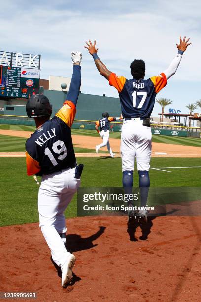 Las Vegas Aviators infielder Dalton Kelly and Las Vegas Aviators outfielder Buddy Reed celebrate after Las Vegas Aviators outfielder Luis Barrera hit...