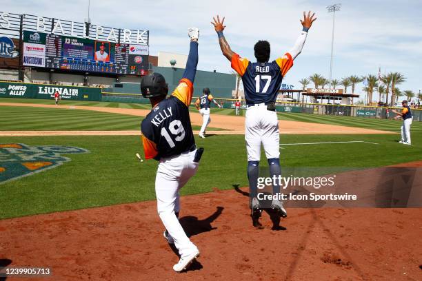 Las Vegas Aviators infielder Dalton Kelly and Las Vegas Aviators outfielder Buddy Reed celebrate after Las Vegas Aviators outfielder Luis Barrera hit...