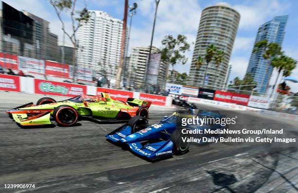 Long Beach, CA Indycar drivers Devlin Defrancesco and Jimmie Johnson race together onto Shoreline Drive during the 47th annual Acura Grand Prix of...