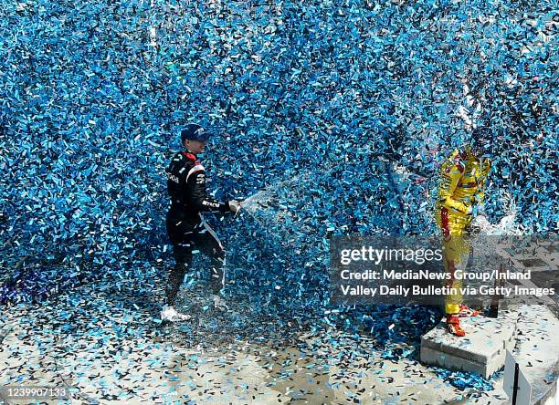 Long Beach, CA Race winner Josef Newgarden sprays second place finisher Romain Grosjean with champagne as they celebrate in victory lane following...