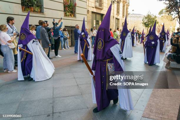 Several Nazarenes seen during the procession of Nuestro Padre Jesus del PerdÃ³n through the streets of downtown Madrid. After two years interrupted...