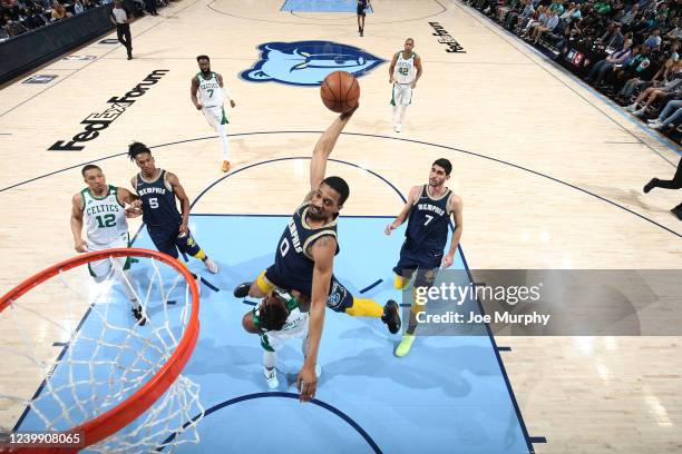 De'Anthony Melton of the Memphis Grizzlies dunks the ball during the game against the Boston Celtics on April 10, 2022 at FedExForum in Memphis,...