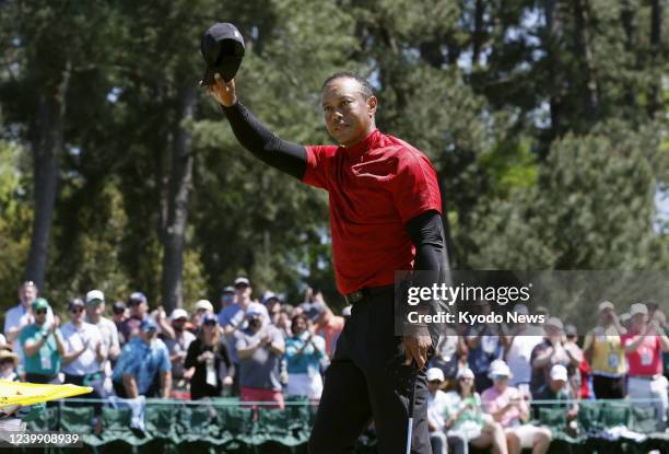 Tiger Woods tips his cap after completing his final round of the Masters Tournament on April 10 at Augusta National Golf Club in Augusta, Georgia.