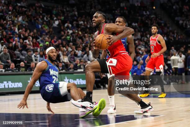 Patrick Williams of the Chicago Bulls is fouled by Josh Okogie of the Minnesota Timberwolves while driving to the basket in the fourth quarter at...