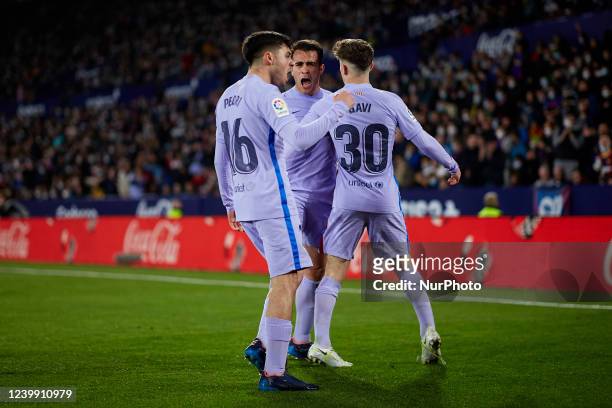 Pedri of FC Barcelona celebrates his side's second goal with his teammates Gavi and Eric Garcia during the La Liga Santander match between Levante UD...