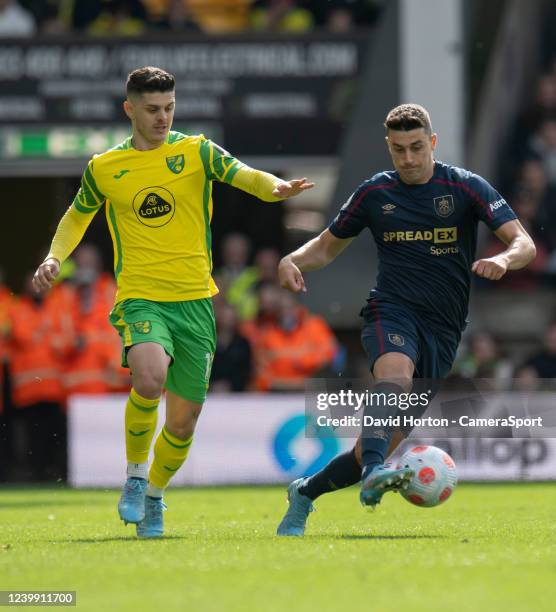 Burnley's Matthew Lowton holds off the challenge from Norwich City's Milot Rashica during the Premier League match between Norwich City and Burnley...