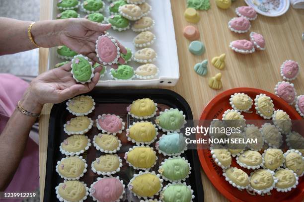Catholic Christian devotee prepares Easter eggs made from marzipan at her home in Secunderabad, the twin city of Hyderabad on April 11 ahead of...