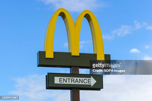 McDonald's sign outside a drive thru branch.