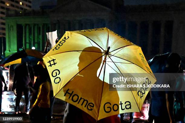 Buddhist monk takes part in a demonstration against the economic crisis at the entrance of the president's office in Colombo on April 11, 2022. - Sri...