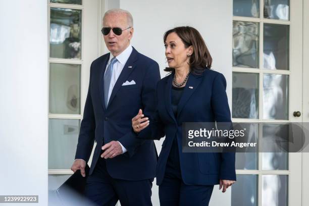 President Joe Biden and Vice President Kamala Harris walk back to the Oval Office after an event about gun violence in the Rose Garden of the White...