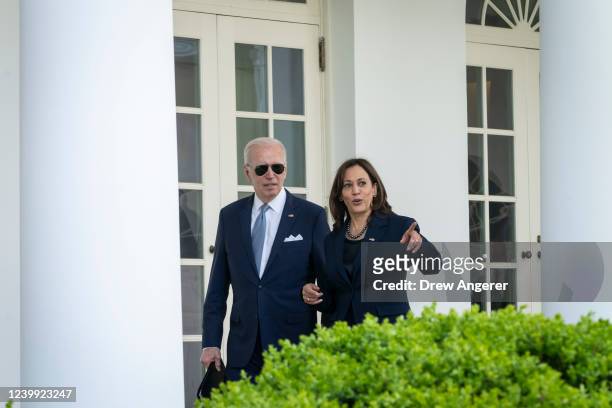 President Joe Biden and Vice President Kamala Harris walk back to the Oval Office after an event about gun violence in the Rose Garden of the White...