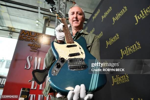 The blue 1969 Mustang Fender guitar used by rock icon Kurt Cobain in the 1991 Nirvana music video "Smells Like Teen Spirit" is displayed by Julien's...