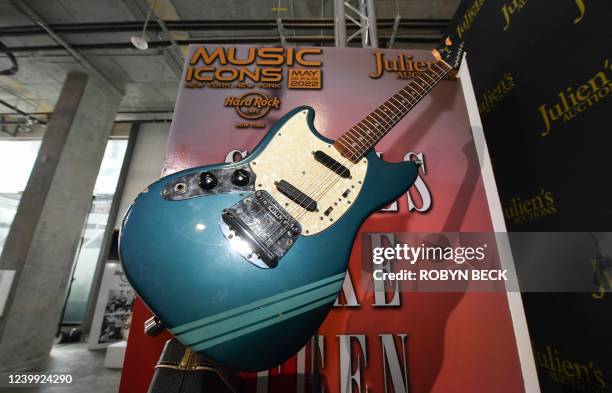 The blue 1969 Mustang Fender guitar used by rock icon Kurt Cobain in the 1991 Nirvana music video "Smells Like Teen Spirit" is displayed at the media...