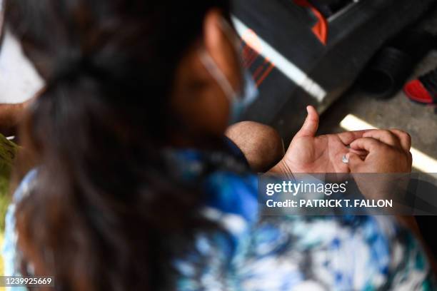 Woman from Mexico recounts her experience fleeing violence from organized crime during an interview in the Movimiento Juventud 2000 shelter with...