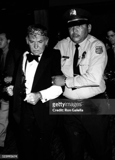 Director Sam Peckinpah escorted out of 2nd Annual American Film Institute Lifetime Achievement Awards Honoring James Cagney on March 13, 1974 at the...