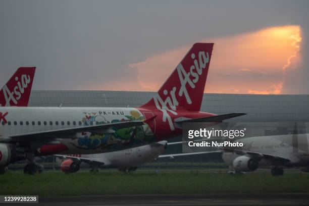 Airplane of Air Asia on the apron of Soekarno Hatta International Airport, Jakarta 11 April 2022. According to The Transportation Ministry's...