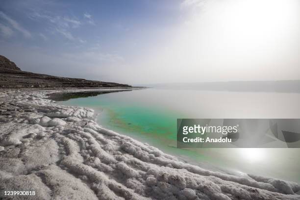 View of the Dead Sea, located 50 km from the capital Amman in Jordan on April 12, 2022. The Dead Sea, famous for its mud used for skin treatment, is...