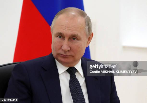 Russia's President Vladimir Putin looks on during talks with Belarus President Alexander Lukashenko at the engineering building of the technical...