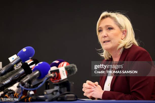 French far-right party Rassemblement National presidential candidate Marine Le Pen addresses a press conference ahead of the April 24 French...