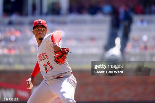 Hunter Greene of the Cincinnati Reds pitches during the game between the Cincinnati Reds and the Atlanta Braves at Truist Park on Sunday, April 10,...