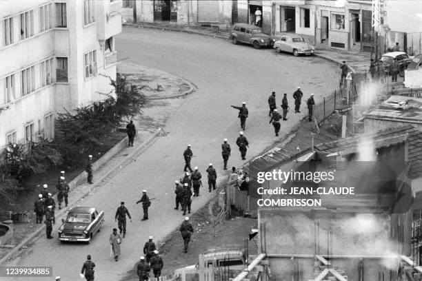 French legionnaires take position on December 11, 1960 in Algiers streets during protests by pro-independence Muslim Algerians who demonstrate in the...