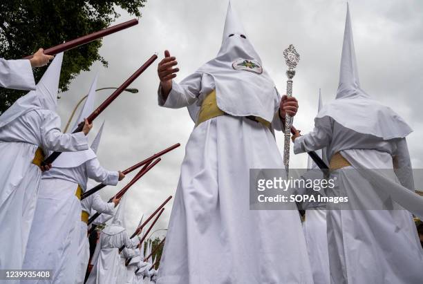 Penitents march during a procession as they celebrate Holy Monday. After two years of Covid-19 travel restrictions and cancellations in Spain, they...
