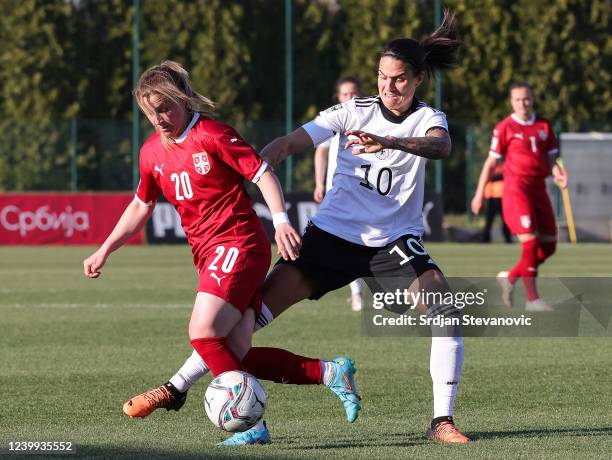 Tijana Filipovic of Serbia in action against Dzsenifer Marozsan of Germany during the FIFA Women's World Cup 2023 Qualifier group H match between...