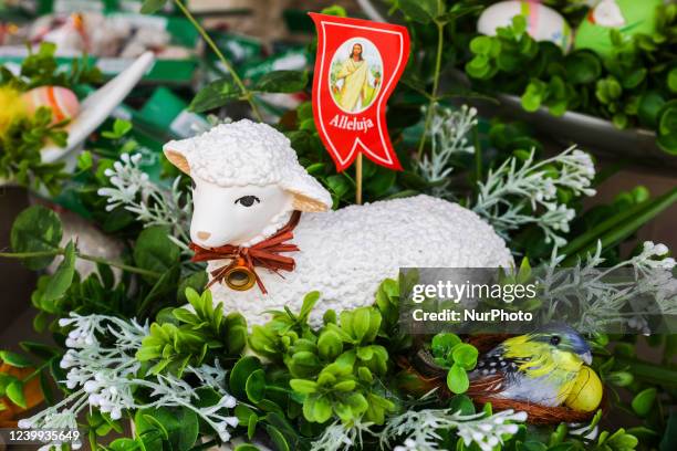 Traditional Paschal Lamb is seen at thel Easter Market at the Main Square in Krakow, Poland on April 12h, 2022. Colourful Easter eggs, handmade...