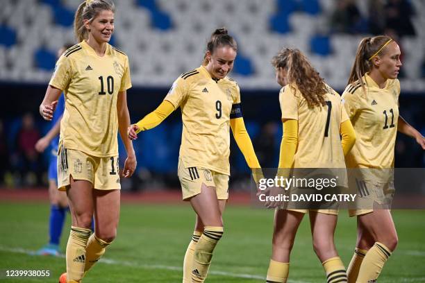 Belgium's Justine Vanhaevermaet, Belgium's Tessa Wullaert, Belgium's Jarne Teulings and Belgium's Janice Cayman celebrate after scoring during the...