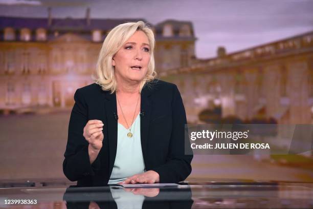 French far-right party Rassemblement National presidential candidate Marine Le Pen takes part in the evening news broadcast of French TV channel TF1,...