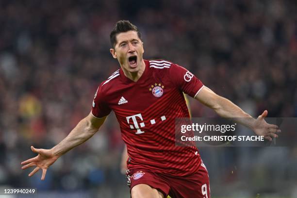 Bayern Munich's Polish forward Robert Lewandowski celebrates scoring the opening goal during the UEFA Champions League quarter-final, second leg...