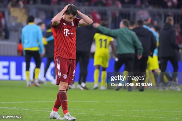 Bayern Munich's Polish forward Robert Lewandowski reacts after the UEFA Champions League quarter-final, second leg football match FC Bayern Munich v...