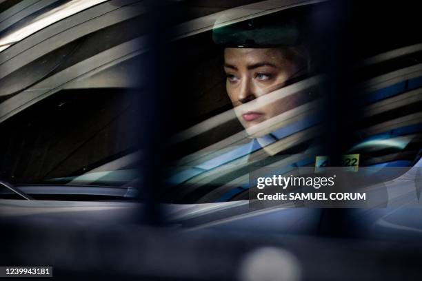 Actress Amber Heard leaves the Fairfax County Circuit Court in Fairfax, Virginia, on April 12, 2022. - Heard is being sued for defamation by her...