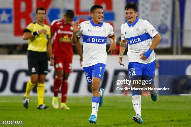 Marcelino Núñez of Universidad Catolica celebrates with teammate Alfonso Parot after scoring the first goal of his team during a match between...