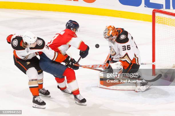 Goaltender John Gibson of the Anaheim Ducks stops a shot by Jonathan Huberdeau of the Florida Panthers in the second period at the FLA Live Arena on...