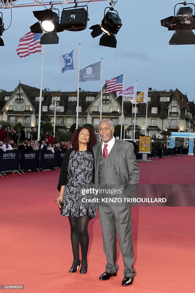 US actor Danny Glover (R) and his wife A