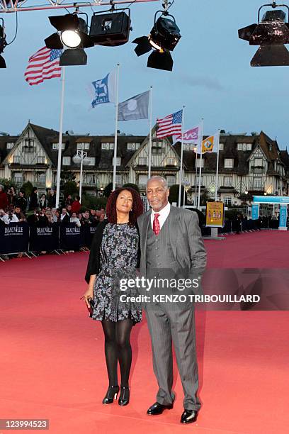Actor Danny Glover and his wife Asake Bomani hit the red carpet before a homage ceremony during the 37th US Film Festival, in Deauville, northwestern...
