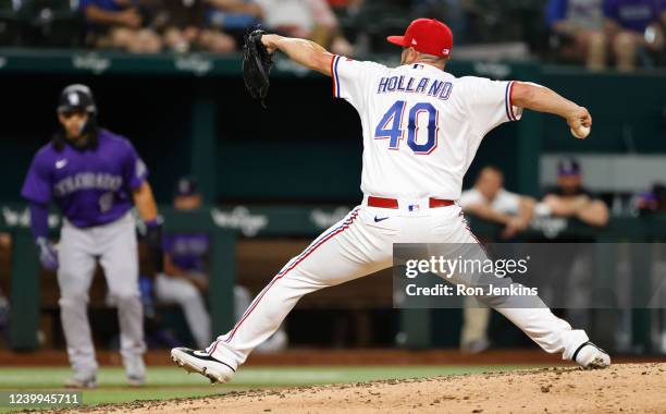 Greg Holland of the Texas Rangers delivers against the Colorado Rockies during the fifth inning at Globe Life Field on April 12, 2022 in Arlington,...