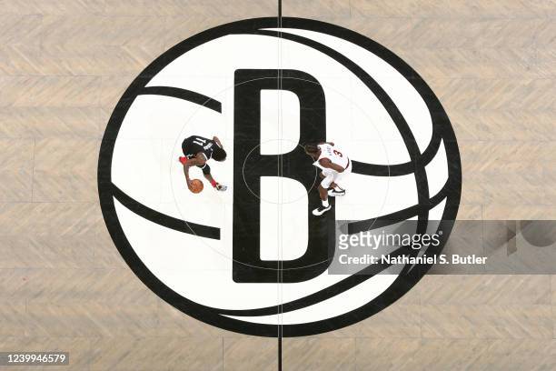Caris LeVert of the Cleveland Cavaliers plays defense on Kyrie Irving of the Brooklyn Nets during the 2022 Play-In Tournament on April 12, 2022 at...