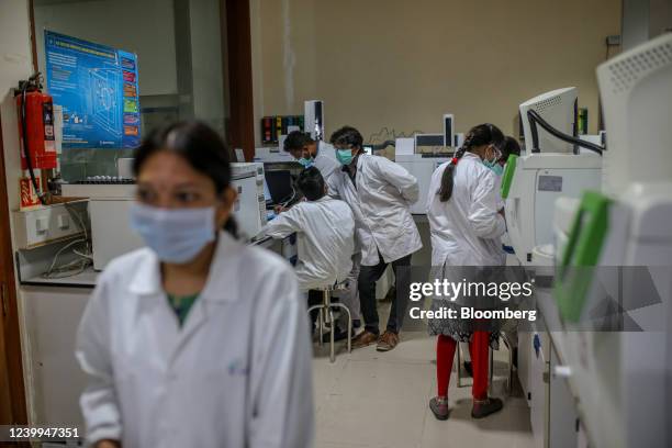 Employees work in a laboratory at a Laurus Labs Ltd. Research and development center in Genome Valley in Hyderabad, India, on Monday, March 21, 2022....