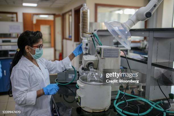 An employee works in a laboratory at a Laurus Labs Ltd. Research and development centre Genome Valley in Hyderabad, India, on Monday, March 21, 2022....
