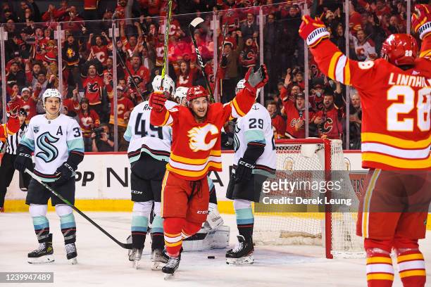 Andrew Mangiapane of the Calgary Flames celebrates after scoring against the Seattle Kraken during the third period of an NHL game at Scotiabank...
